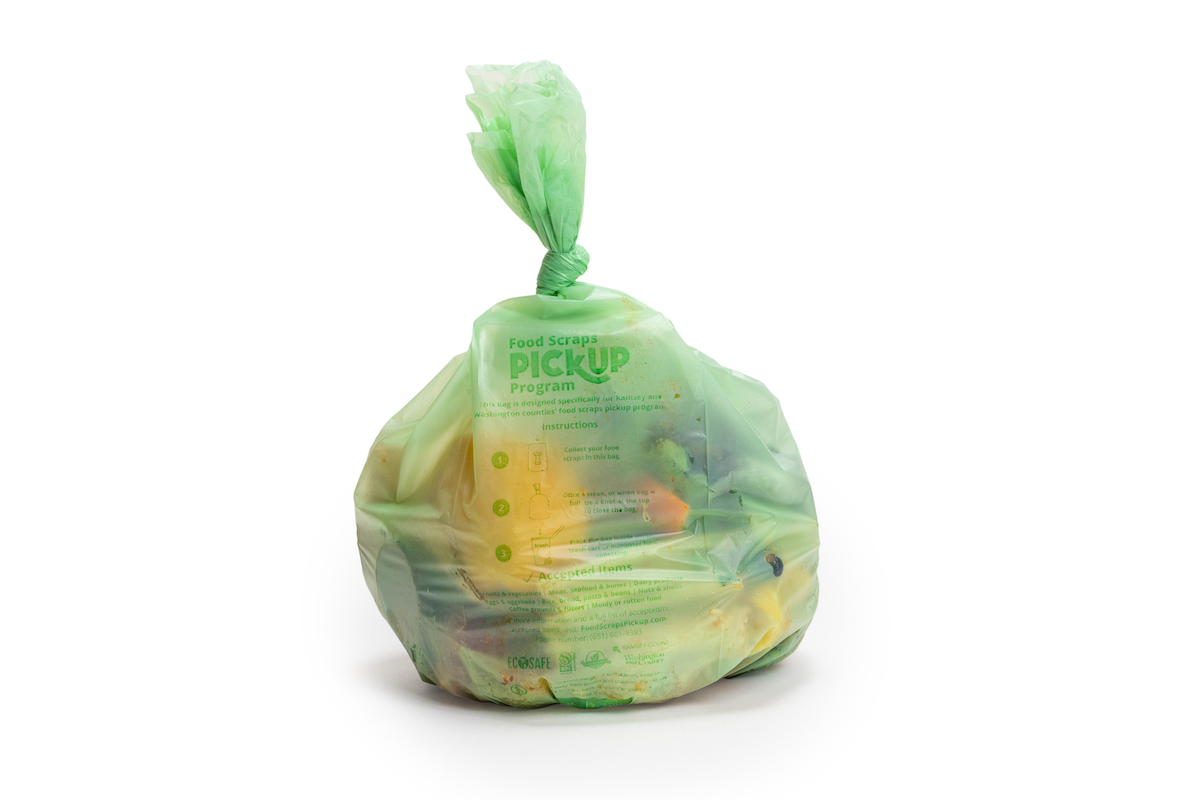 tied up bag filled with food waste