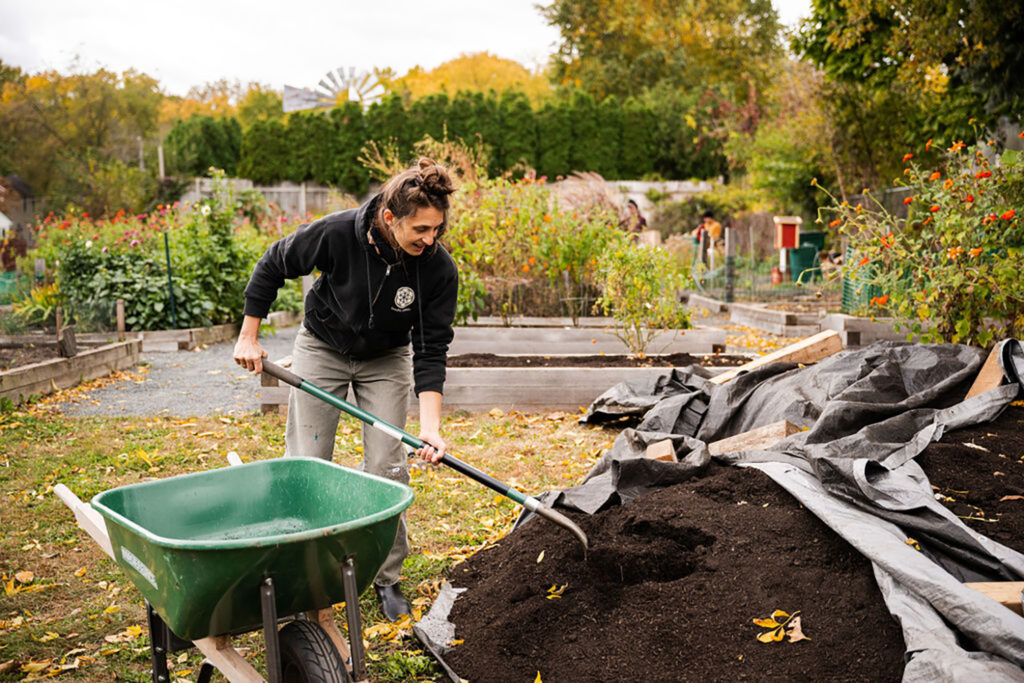 Person shoveling compost